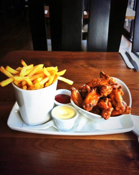 Chicken Wings and Chips on a plate with mayo