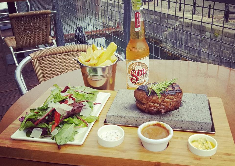 Sizzling 8oz Fillet Steak on a Stone with Chips & Peppered Sauce, Ballymaloe Relish & Garlic Butter