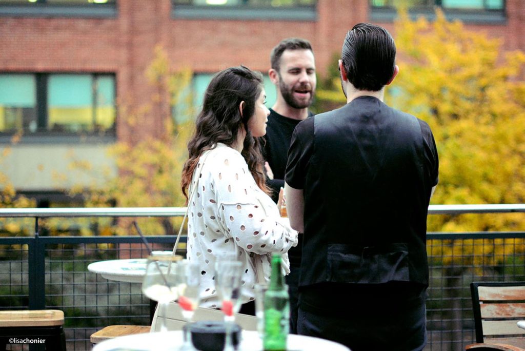 Party guests talking on our terrace